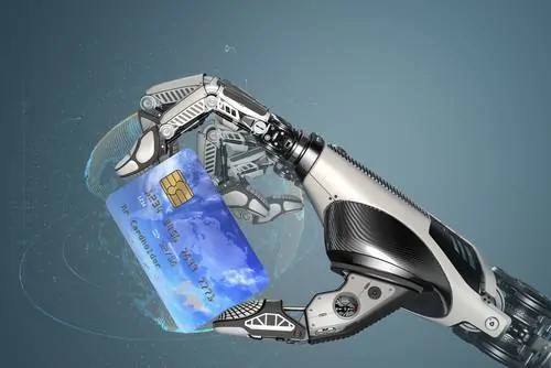 A robotic hand holding a credit card