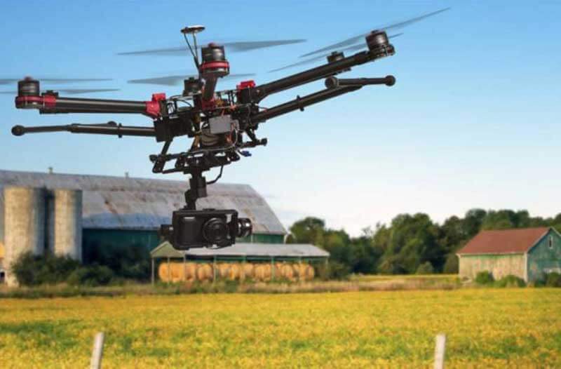 Drone flying above farmland