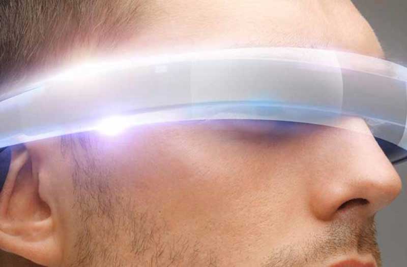 Man with glowing virtual reality glasses
