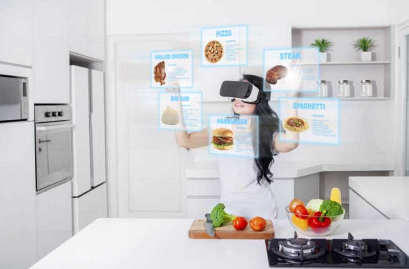 A young girl wears a VR headset in a kitchen and interacts with digital menus