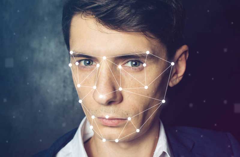 A man’s face mapped with white lines and dots