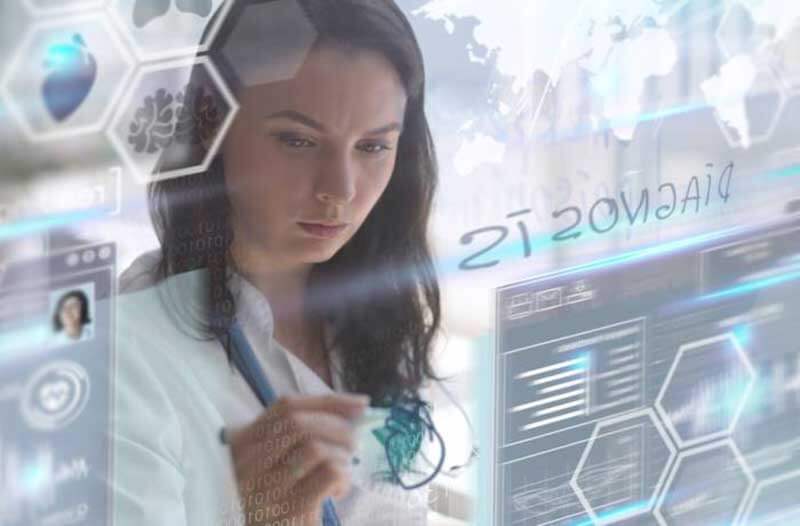 Female doctor drawing on a virtual screen featuring virtual icons
