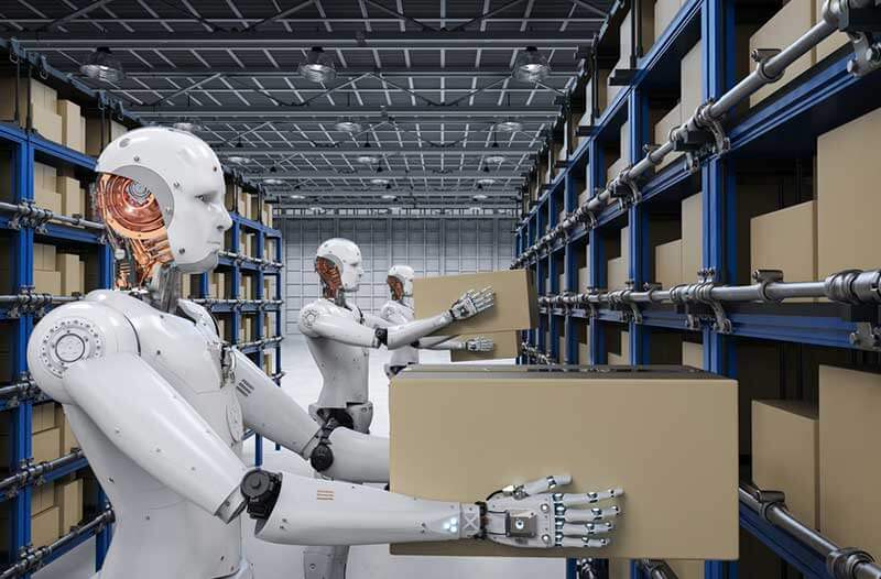 Robot in a warehouse holding a cardboard box