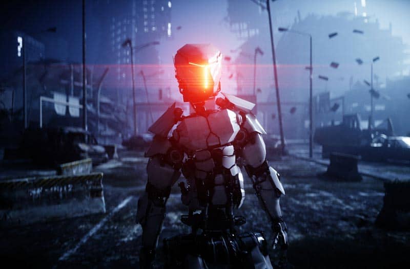 A humanoid robot standing in the street of a city in ruins, with a red glow emitting from its head